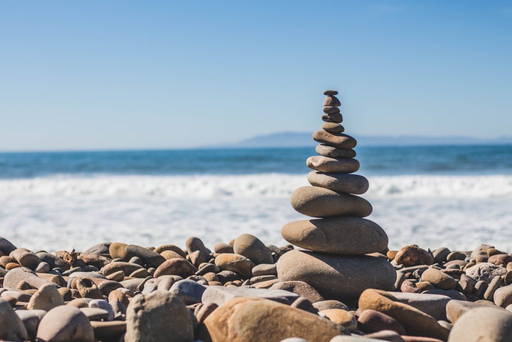 stone cairn on beach