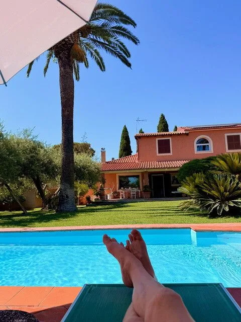 person relaxing near resort pool